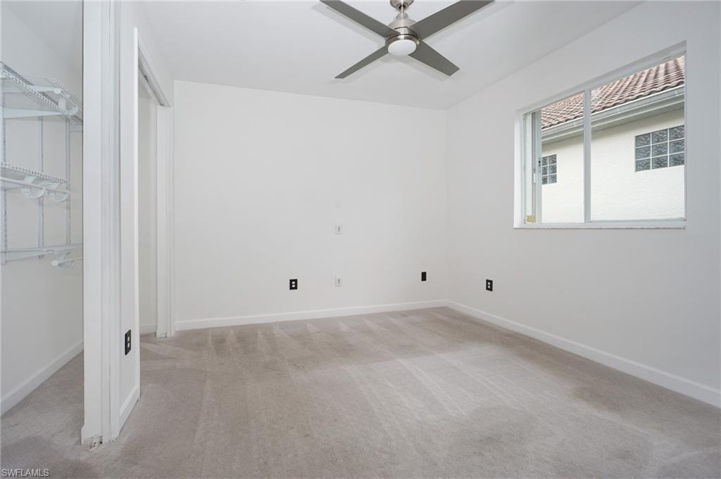3188 Sundance Circle Naples, FL 34109 - Photo 28 of 39 a view of a room with a fan