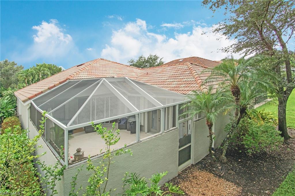 3188 Sundance Circle Naples, FL 34109 - Photo 32 of 39 a house with trees in the background