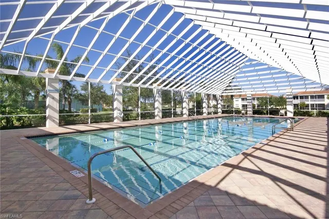 a view of a park with large trees