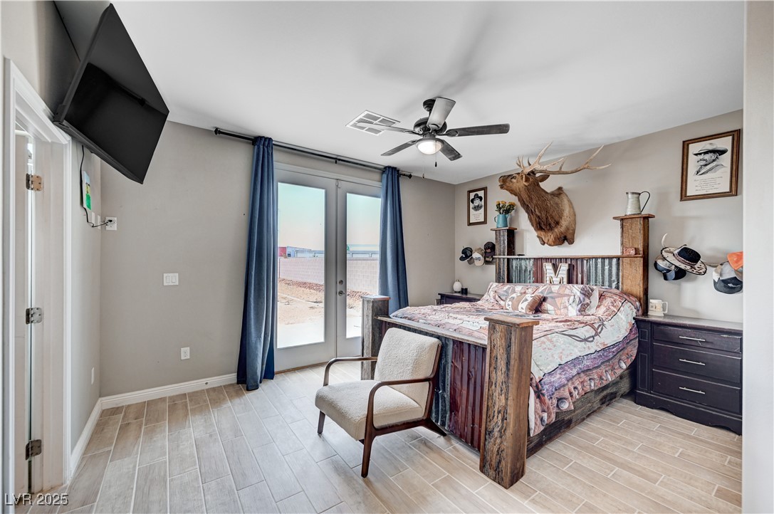 4045 River Heights Lane Logandale, NV 89021 - Photo 13 of 38 Bedroom with french doors, access to exterior, lig
