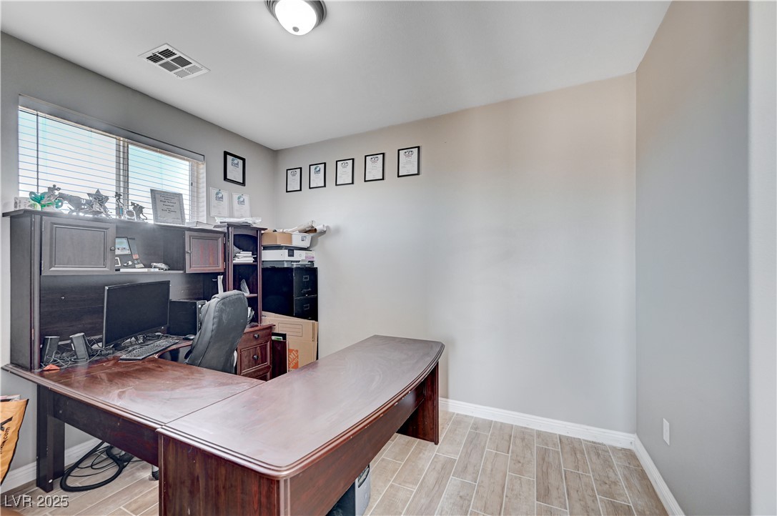 4045 River Heights Lane Logandale, NV 89021 - Photo 15 of 38 Office area featuring wood tiled floors and basebo