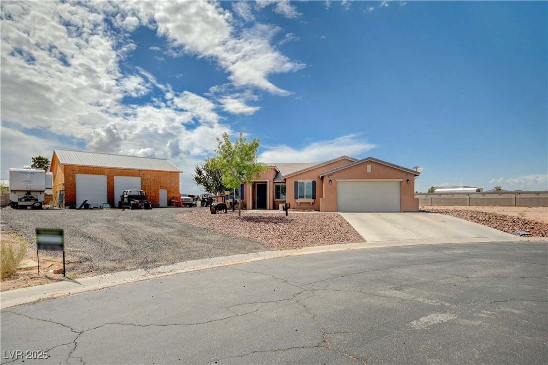 4045 River Heights Lane Logandale, NV 89021 - Photo 2 of 38 Ranch-style home with driveway and an attached gar