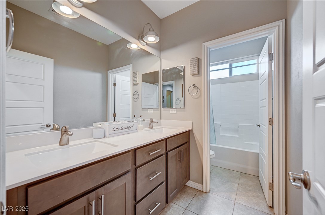 4045 River Heights Lane Logandale, NV 89021 - Photo 21 of 38 Full bathroom with double vanity, tub / shower com