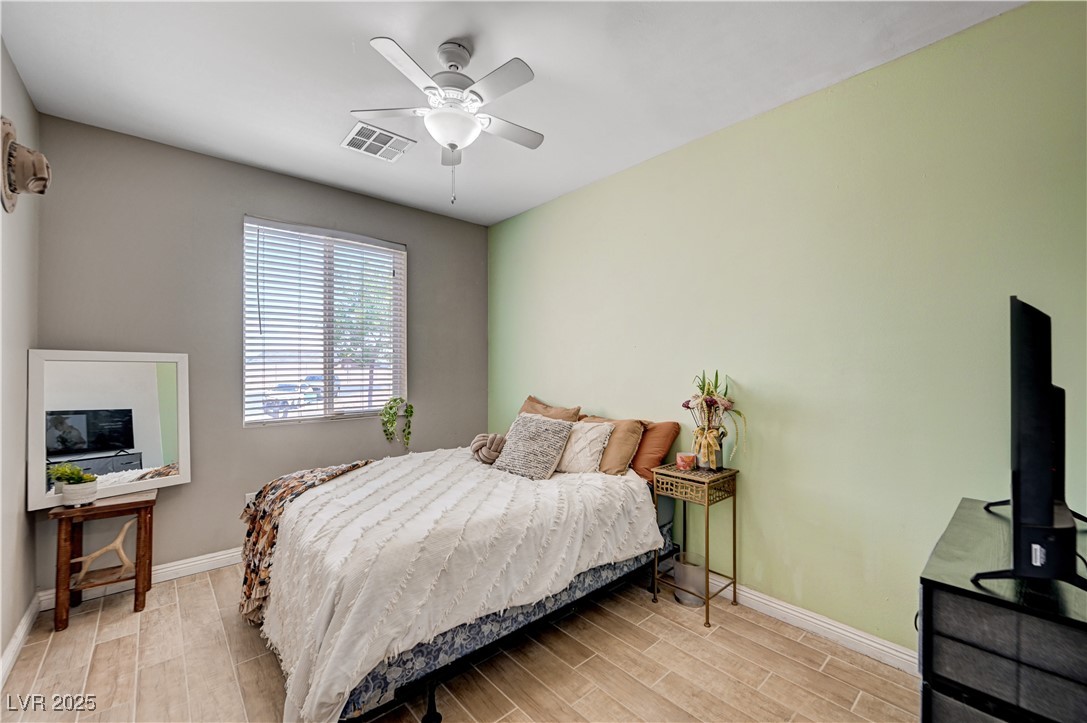 4045 River Heights Lane Logandale, NV 89021 - Photo 22 of 38 Bedroom with wood finished floors and ceiling fan