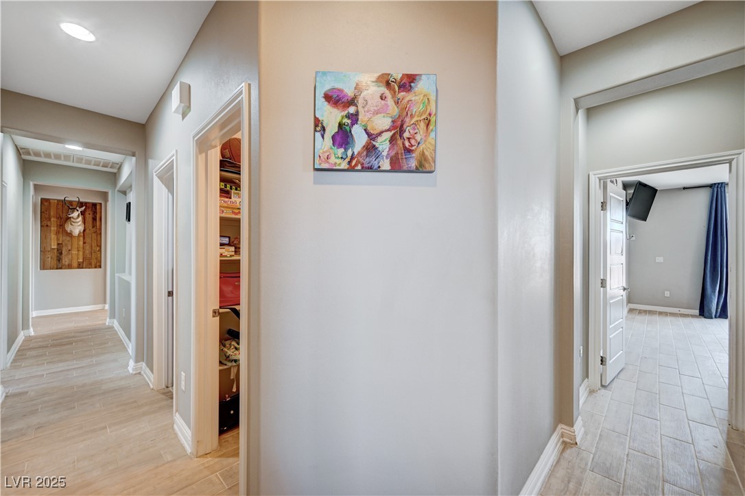 4045 River Heights Lane Logandale, NV 89021 - Photo 24 of 38 Hallway featuring light wood-style floors and base