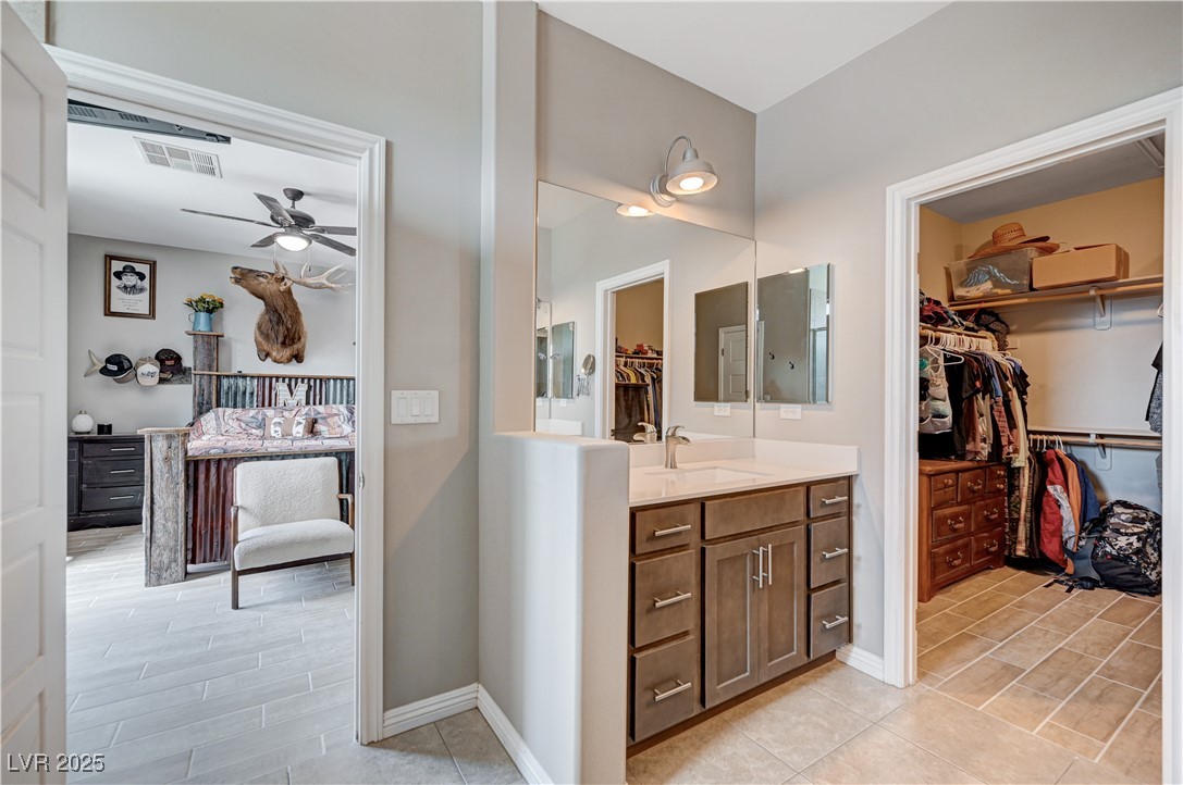 4045 River Heights Lane Logandale, NV 89021 - Photo 26 of 38 Full bath featuring vanity, ceiling fan, a walk in