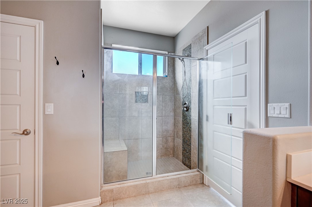 4045 River Heights Lane Logandale, NV 89021 - Photo 28 of 38 Full bath with a shower stall, vanity, and tile pa