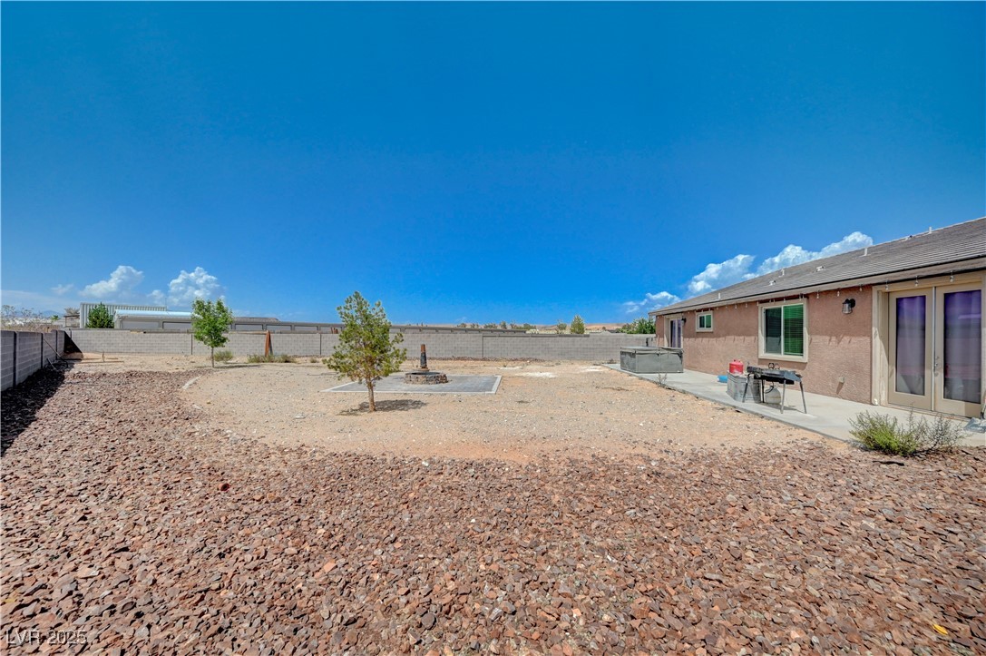 4045 River Heights Lane Logandale, NV 89021 - Photo 30 of 38 Fenced backyard featuring a patio area and an outd