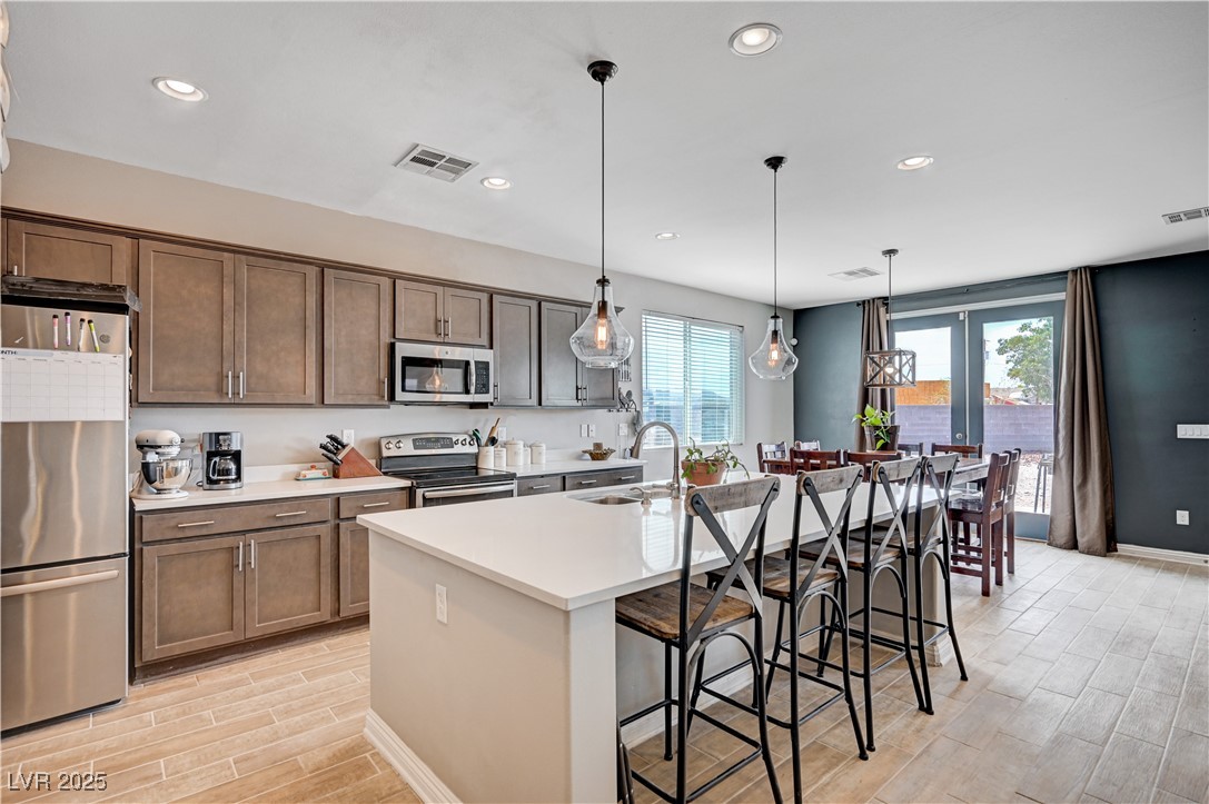 4045 River Heights Lane Logandale, NV 89021 - Photo 5 of 38 Kitchen with stainless steel appliances, wood fini