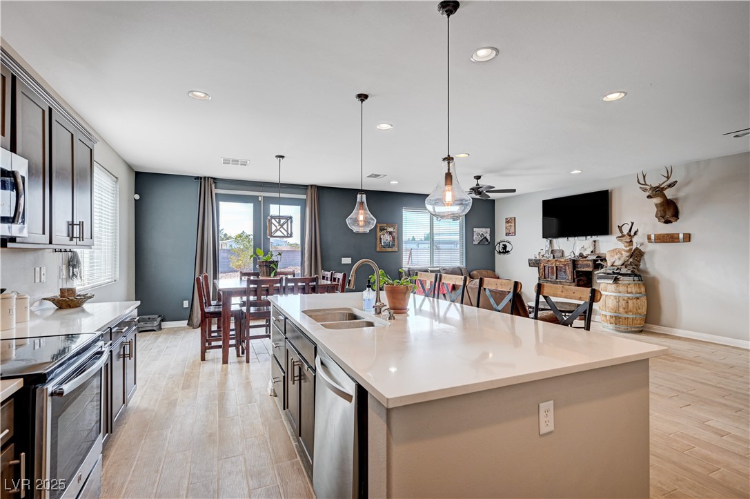 4045 River Heights Lane Logandale, NV 89021 - Photo 6 of 38 Kitchen featuring stainless steel appliances, ligh