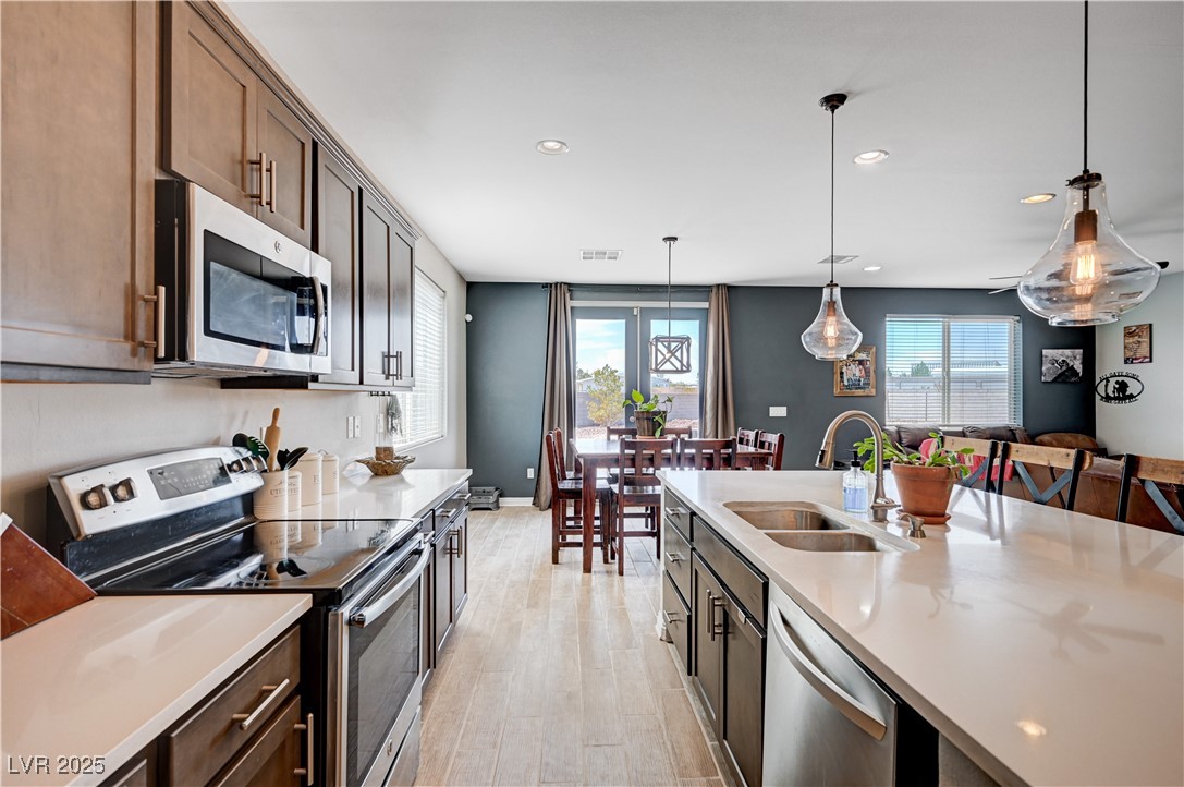 4045 River Heights Lane Logandale, NV 89021 - Photo 8 of 38 Kitchen with stainless steel appliances, light cou