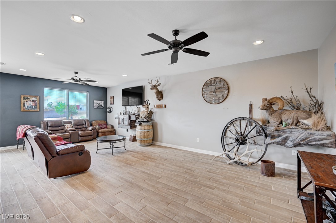 4045 River Heights Lane Logandale, NV 89021 - Photo 9 of 38 Living room featuring a ceiling fan, light wood fi