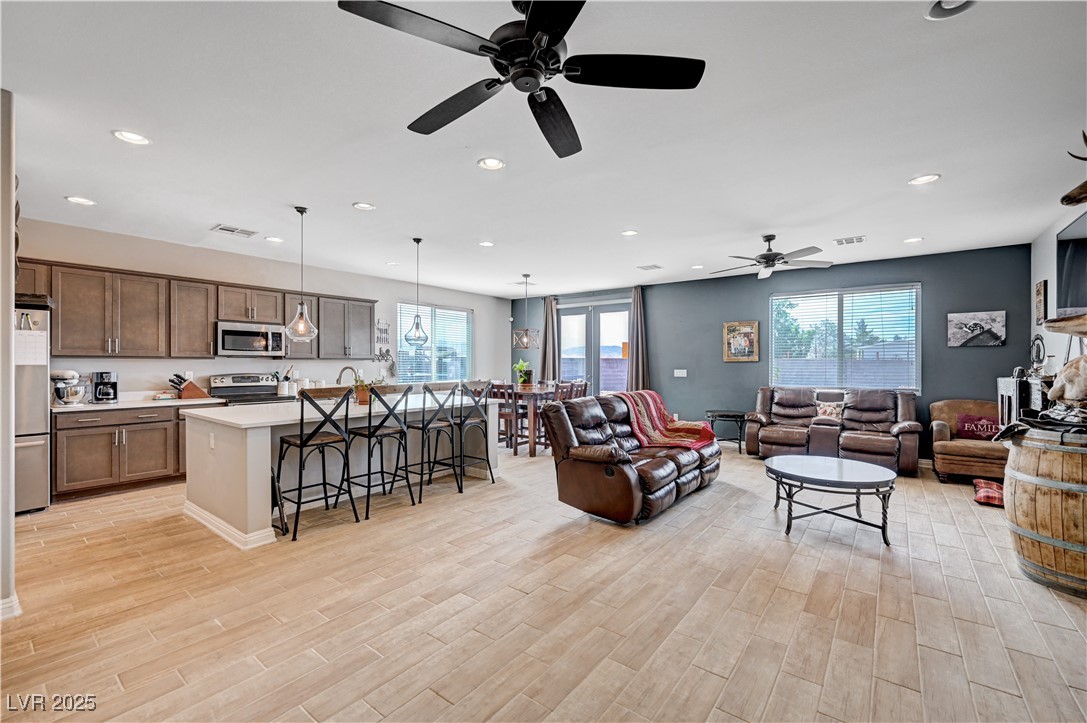 4045 River Heights Lane Logandale, NV 89021 - Photo 10 of 38 Living area featuring a ceiling fan, plenty of nat