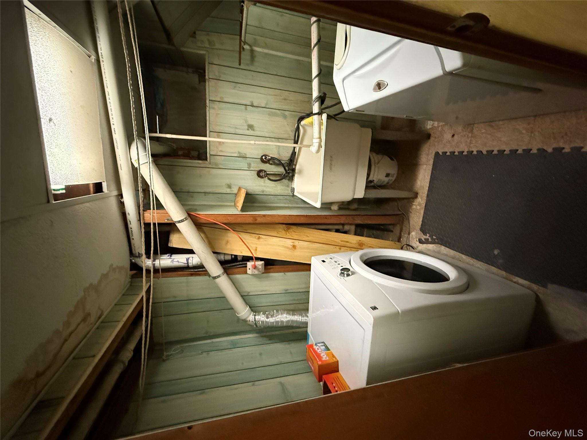104-25 126th Street Queens, NY 11419 - Photo 19 of 22 Washroom with washer / clothes dryer