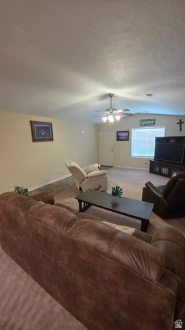 1330 North Dixie Downs Road, Unit 72 St. George, UT 84770 - Photo 14 of 21 Carpeted living room featuring baseboards and a ceiling fan