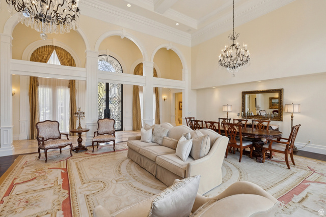 1714 Ridge Point Drive Bountiful, UT 84010 - Photo 28 of 132 Two-story entry foyer with arched openings, ornate chandeliers, decorative ceiling molding, and a wrought iron entry door
