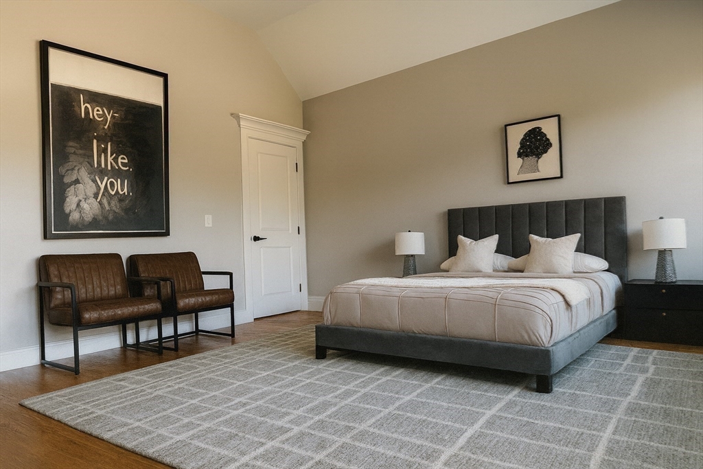 18 Sprague Road Wellesley, MA 02481 - Photo 23 of 35 a bedroom with a bed and a chair