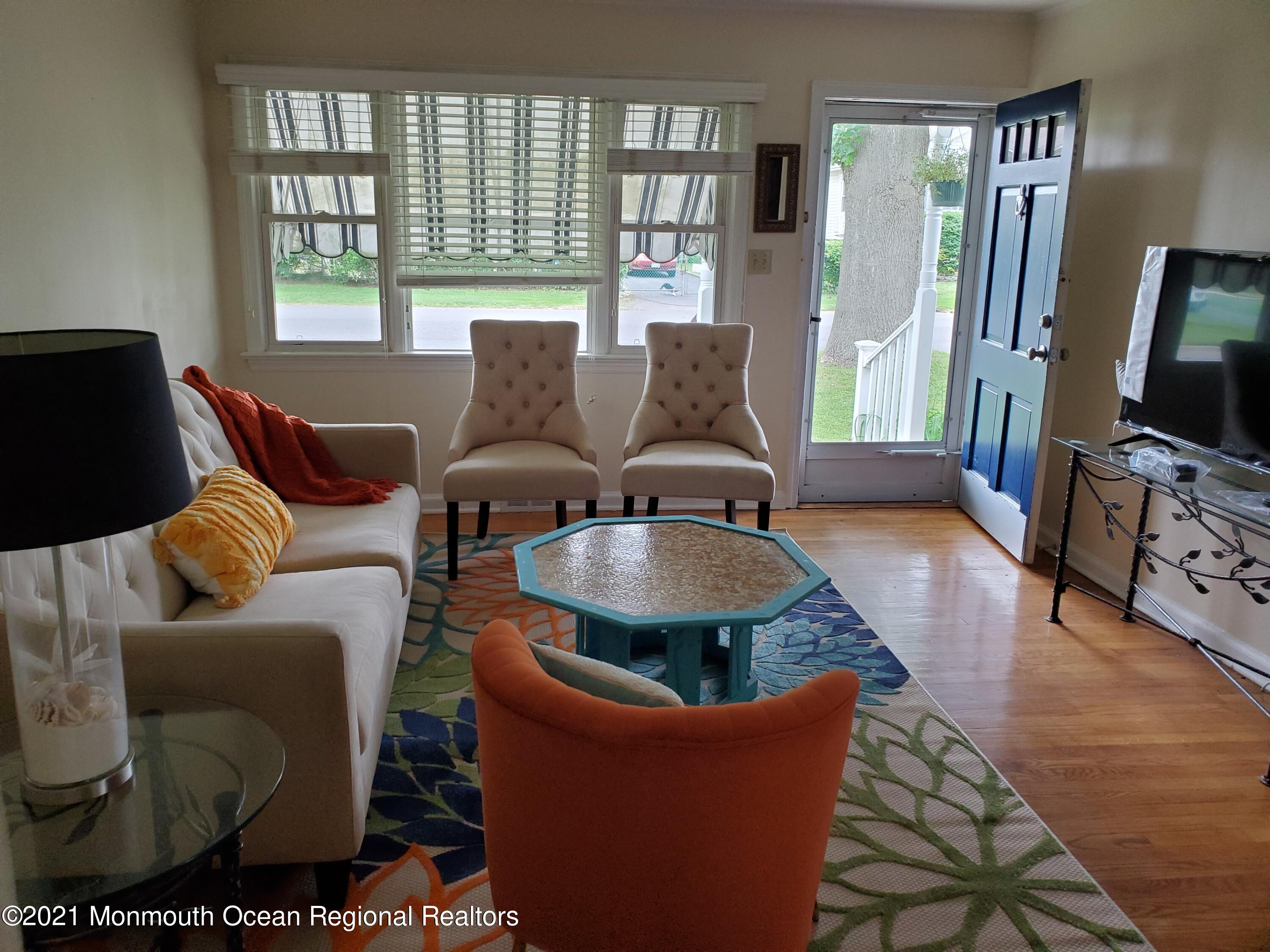 5 Calvert Avenue, Unit B Long Branch, NJ 07740 - Photo 3 of 12 a living room with furniture and a flat screen tv