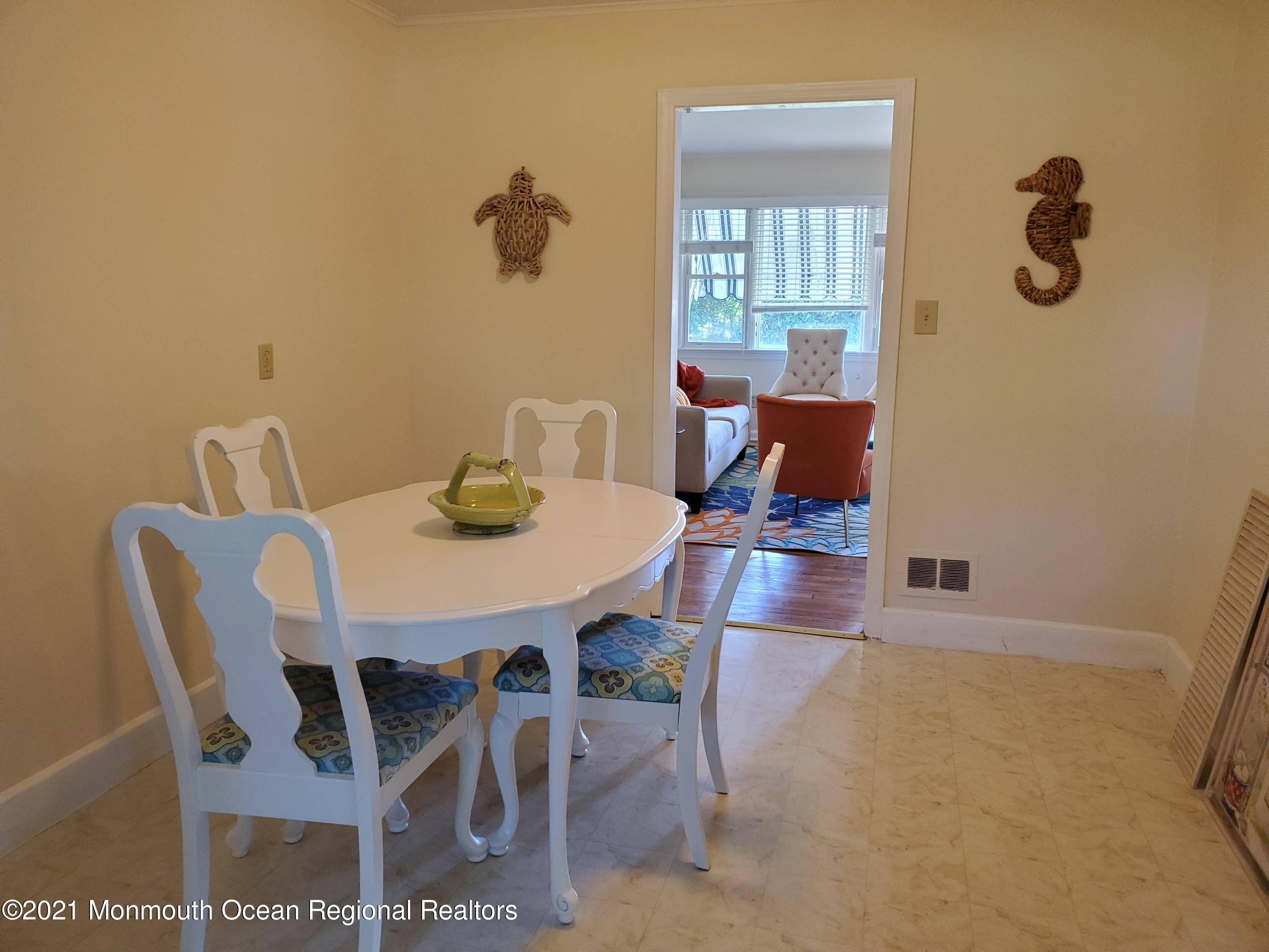 5 Calvert Avenue, Unit B Long Branch, NJ 07740 - Photo 6 of 12 a view of a dining room with furniture and wooden floor