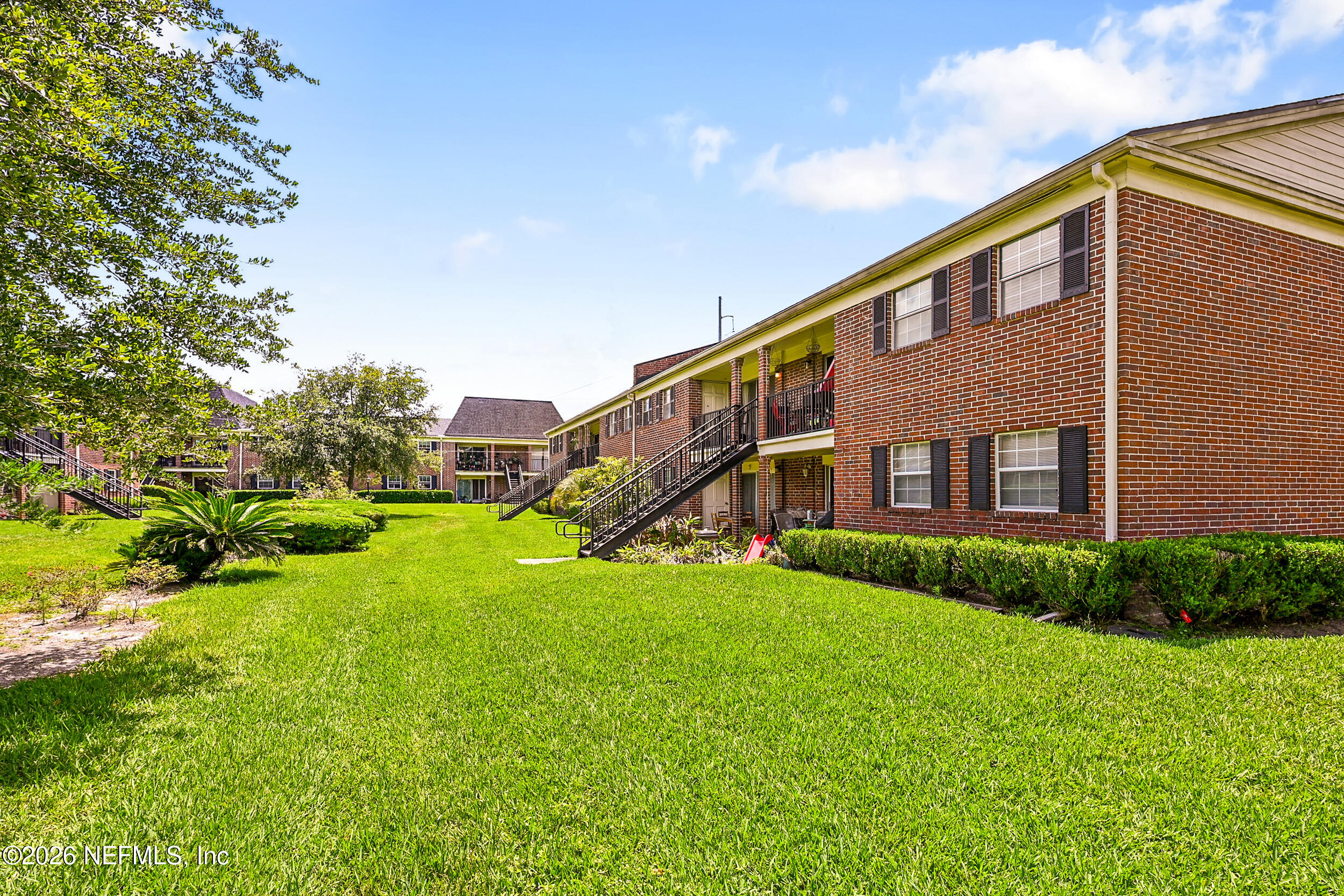 4915 Baymeadows Road, Unit 6G Jacksonville, FL 32217 - Photo 33 of 44 a view of a house with a yard