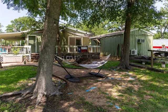 a view of a patio with a yard