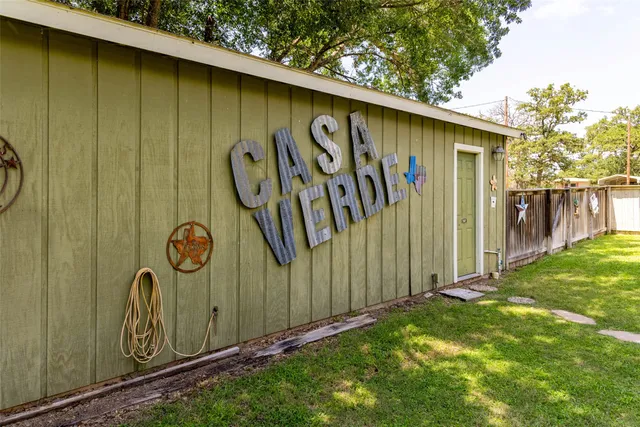 a view of a chair and tables in the balcony