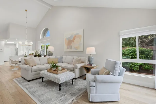 a bathroom with a granite countertop sink vanity and mirror