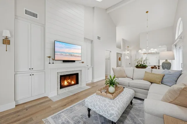 a bathroom with a granite countertop toilet sink and mirror