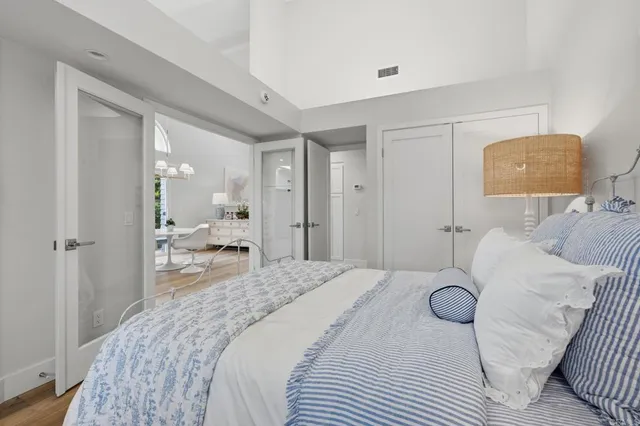 a bedroom with a bed and window