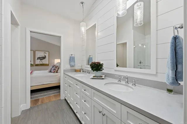 a view of a patio with a dining table and chairs with wooden floor
