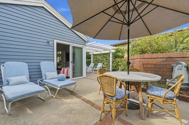 an aerial view of residential houses with outdoor space and river view