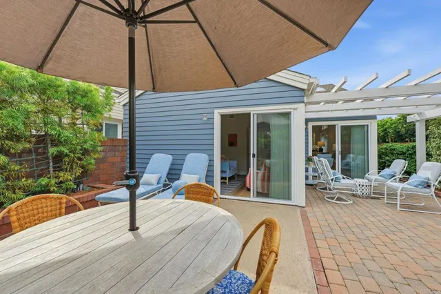 a view of swimming pool with outdoor seating and plants