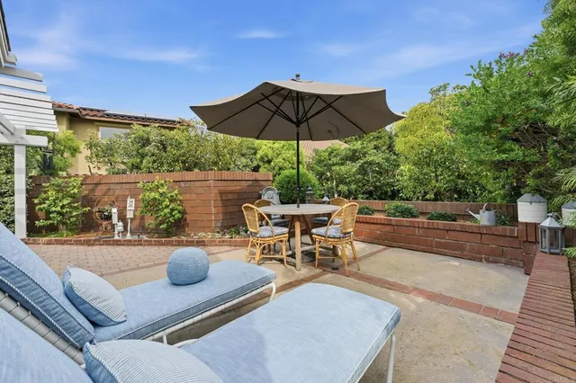 a view of a backyard with sitting area