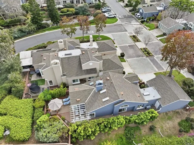 a view of a patio with a table chairs and backyard
