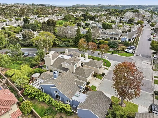 a kitchen with white cabinets counter space and appliances