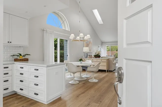 a kitchen with sink cabinets and wooden floor