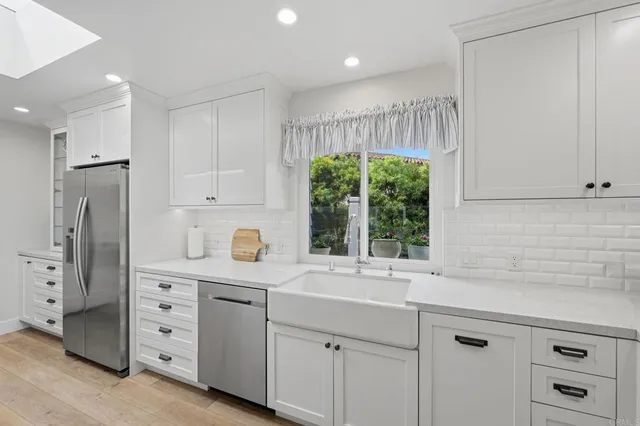 a kitchen with granite countertop a stove and a cabinets