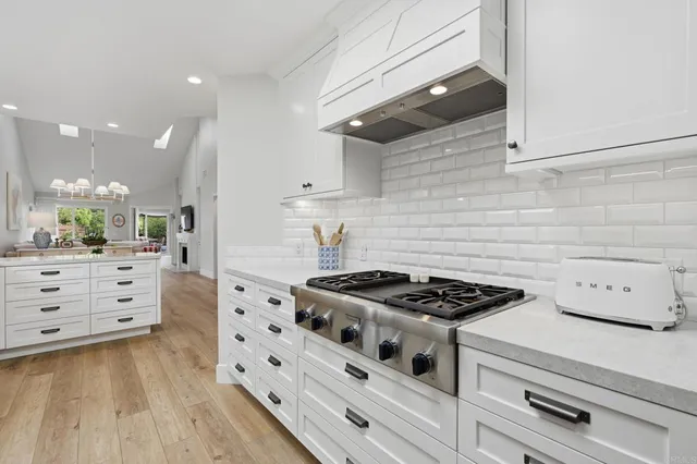 a living room with furniture a window and appliances