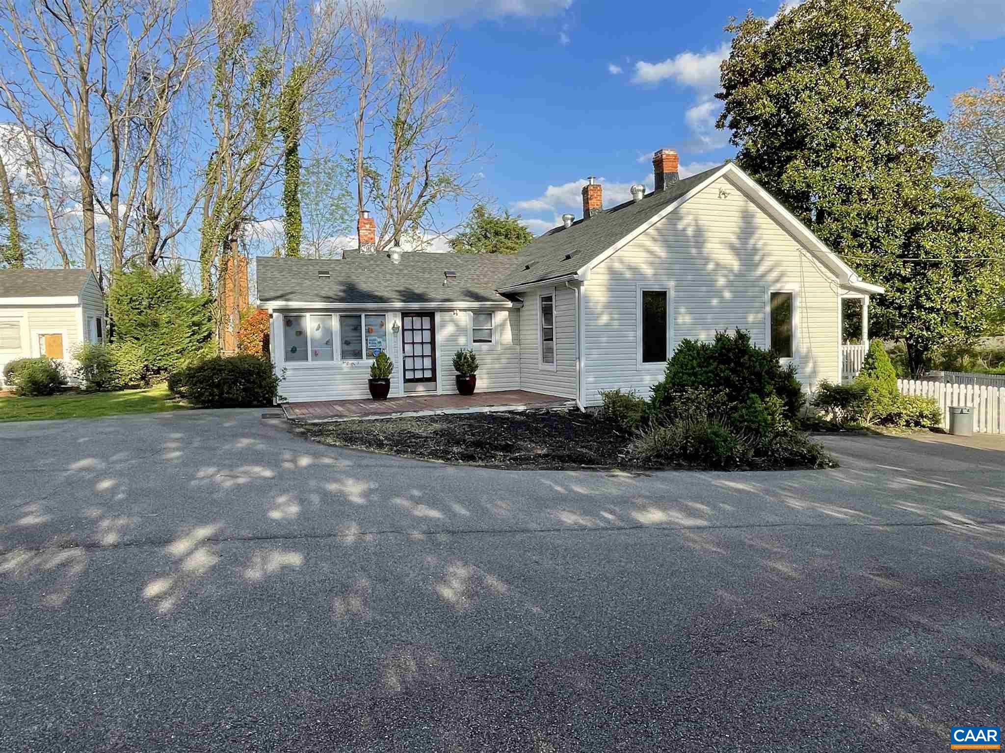 5674 Three Notch'd Road Crozet, VA 22932 - Photo 4 of 8 a front view of house with yard and trees around