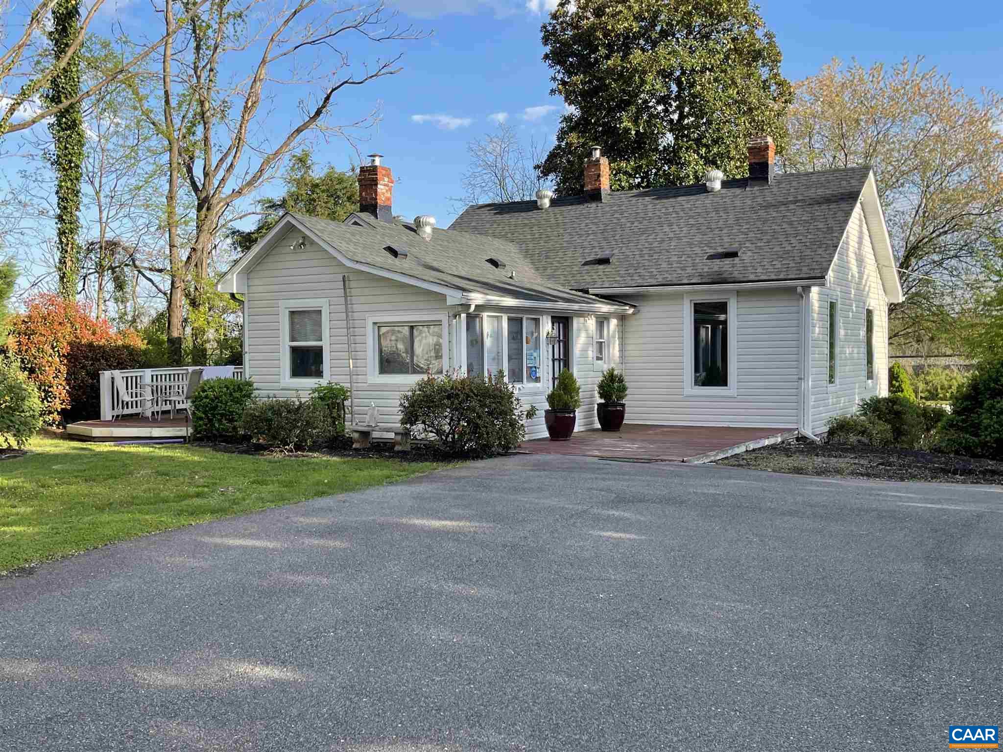 5674 Three Notch'd Road Crozet, VA 22932 - Photo 5 of 8 a front view of a house with a yard and a garage