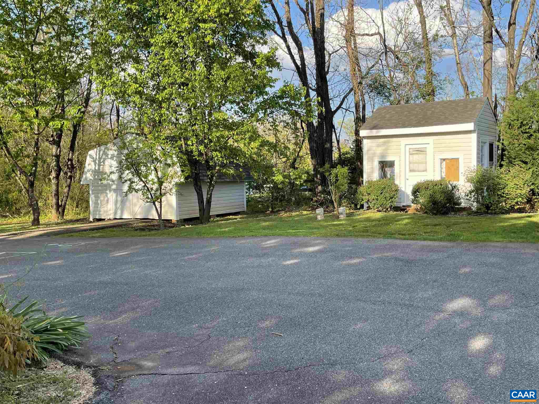 5674 Three Notch'd Road Crozet, VA 22932 - Photo 8 of 8 a front view of a house with a yard and garage