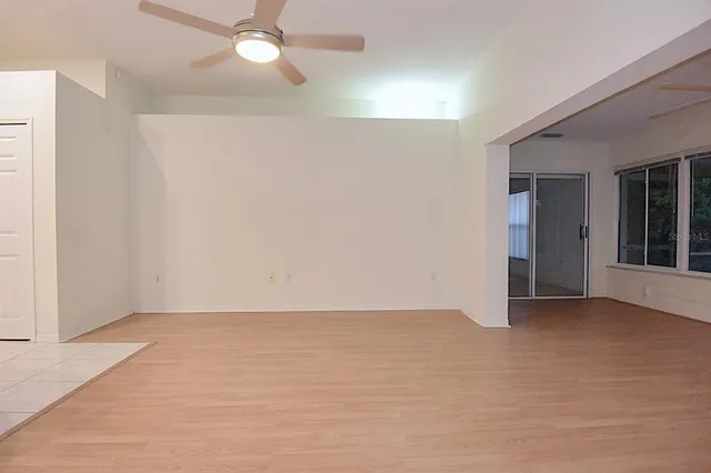 a view of a kitchen with a sink and a refrigerator