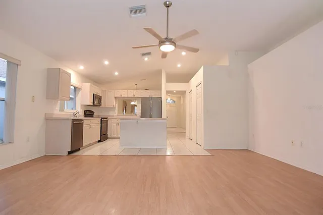 a view of an empty room with a window