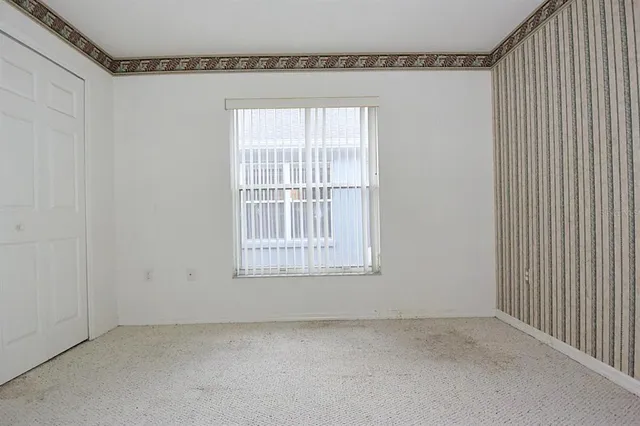 a view of a room with wooden walls