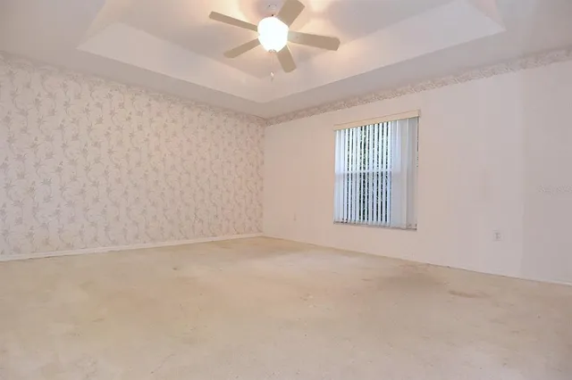 a bedroom with a bed and flat screen tv