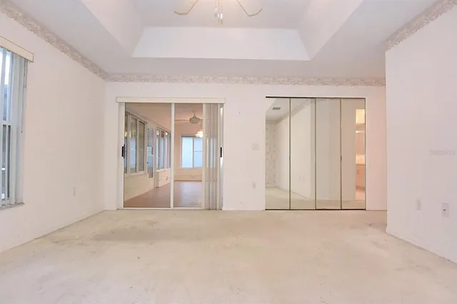 a spacious bathroom with a granite countertop sink a toilet and shower