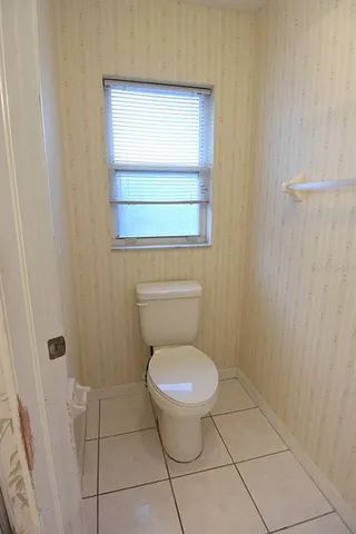 a bathroom with a double vanity sink and mirror