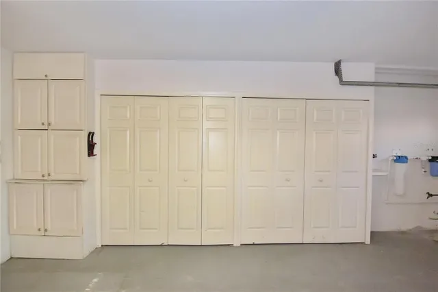 a view of house with backyard and garden