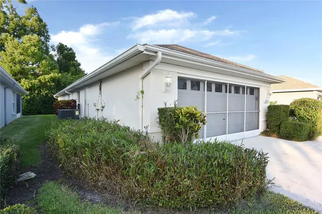 a view of a field with trees in the background