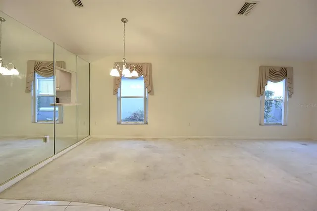 a kitchen with stainless steel appliances a refrigerator sink and microwave